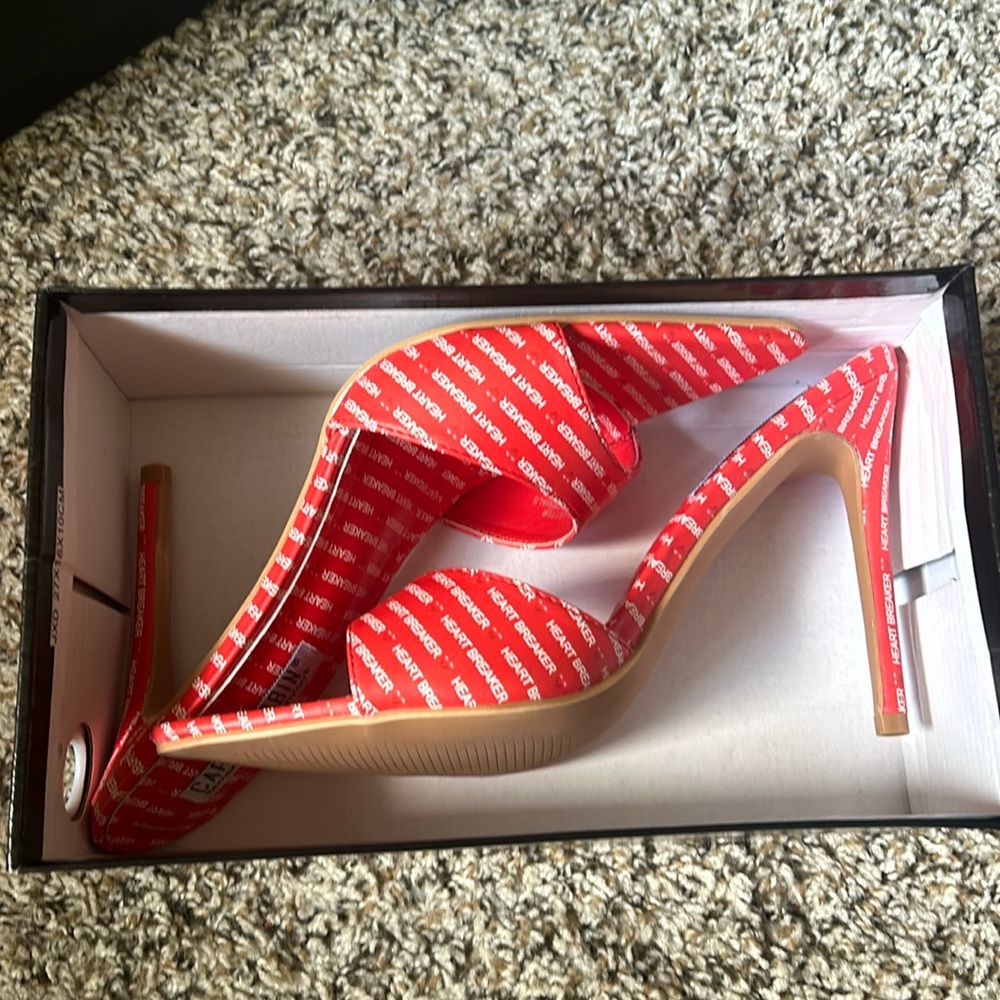 Red heartbreaker pumps
